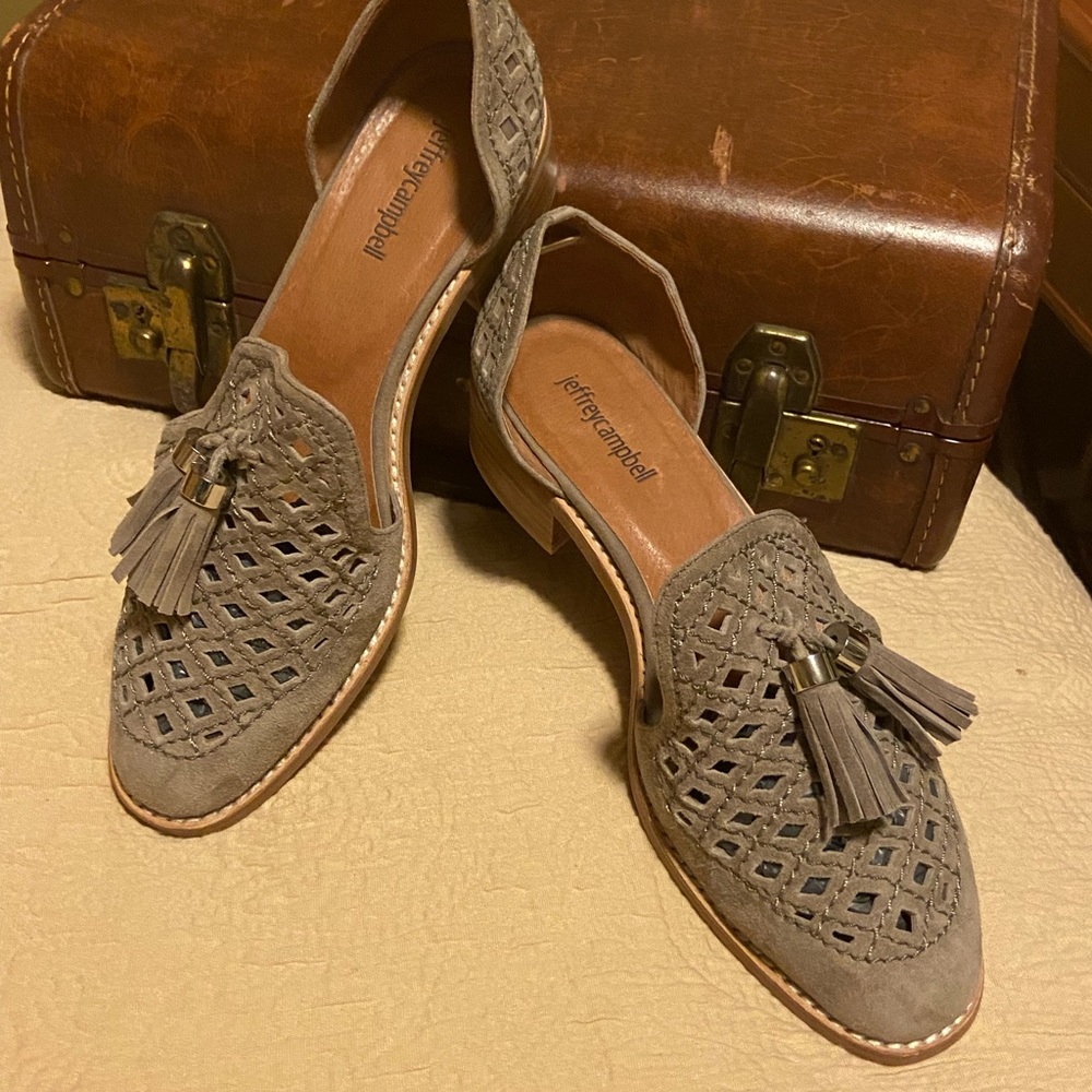 Jeffrey Campbell taupe open cut tasseled suede loafers.
